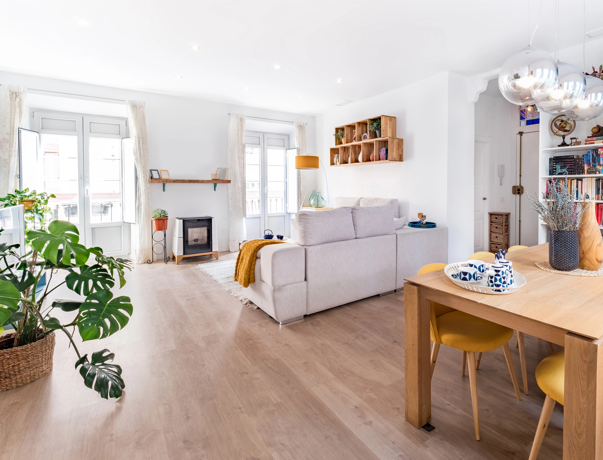 A neatly furnished living room with great lighting