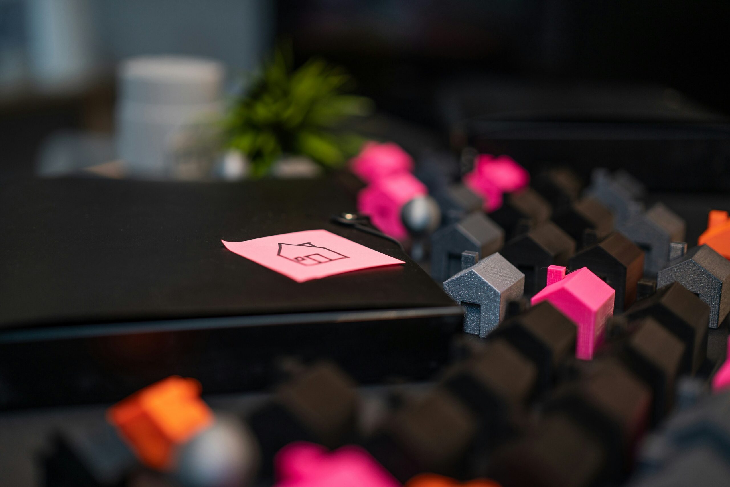 an image of miniature dummy houses and a sticker with a house diagram