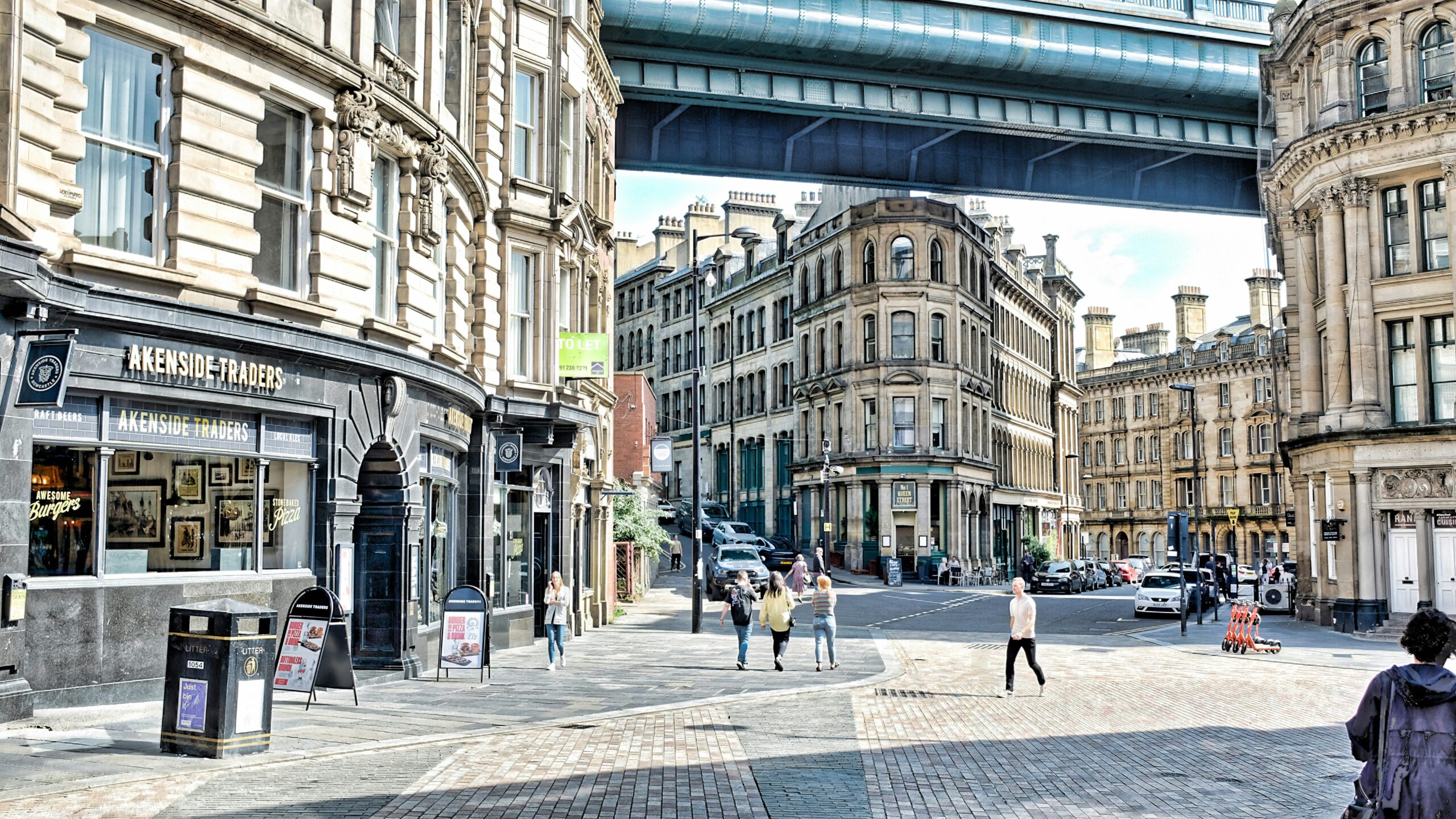 city buildings with people walking around